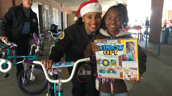 Eighty Students Ride Off On Brand-New Bicycles At NOPD’s 'Christmas In The Sixth' Giveaway Event